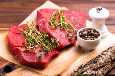 Fresh Raw Beef Tenderloin And Marbled Steaks With Seasoning Stock Image