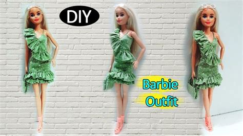 The Barbie Doll Is Wearing A Green Dress