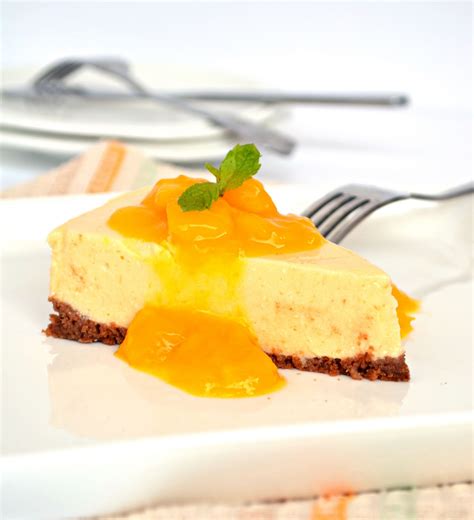 No Bake Mango Cheesecake With Mango Sauce Love And Other Spices