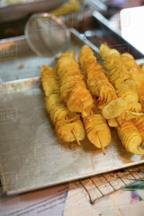 Deep Fried Potato Chips On Wooden Skewers Thailand Stock Photo