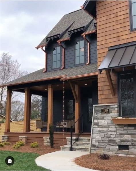 Get inspired by blue here. Black metal roof, horizontal black siding, copper ...