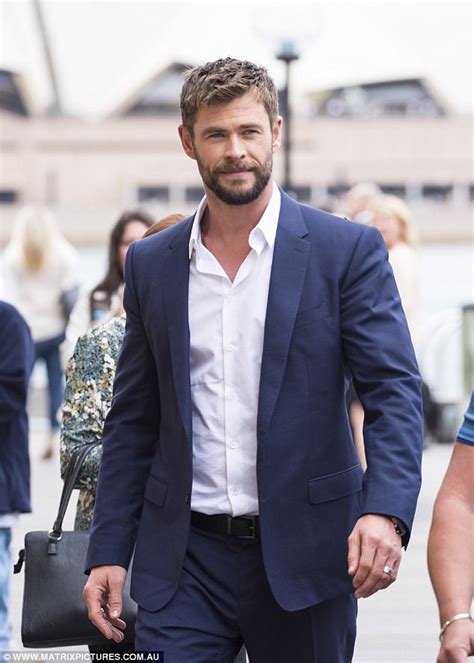 And on tuesday, hollywood heartthrob chris hemsworth showcased his buff build as he stepped out at the hugo boss menswear spring/summer fashion show the australian star's suit was navy, and he wore it with an open collared shirt and a white pocket square. Chris Hemsworth wears a suit in Sydney | Daily Mail Online