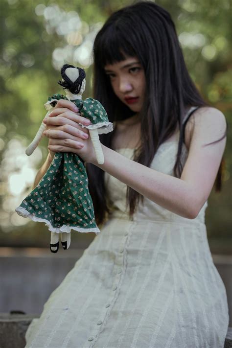 Girl Holding A Doll · Free Stock Photo