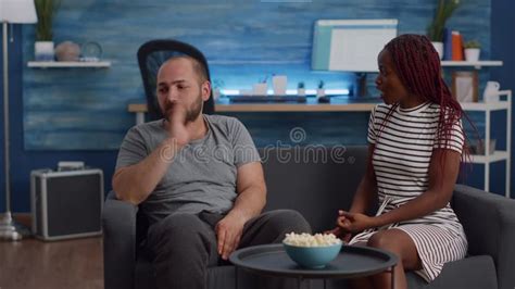 Angry Interracial Couple Fighting On Living Room Sofa Stock Footage