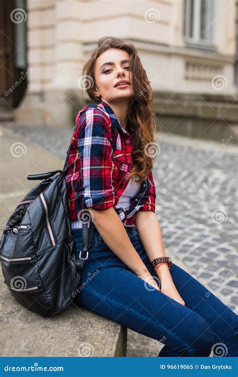 Young Beauty Woman Posing In The Street With Backpack Brunette Hair