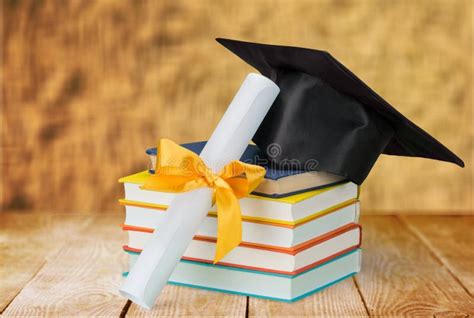 Graduation Hat On Stack Of Books And Diploma Stock Photo Image Of