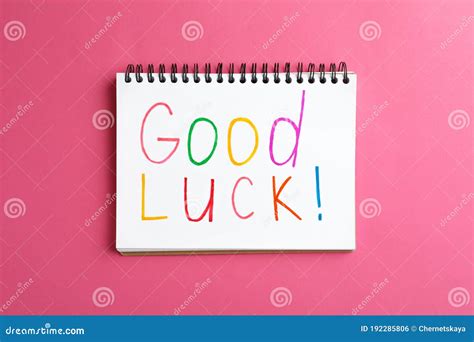 Notebook With Phrase Good Luck On Pink Background Stock Photo Image
