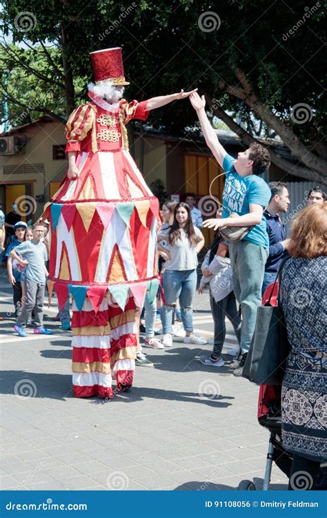 Clown On Stilts Greets Visitors To The Attractions Park Editorial Photo
