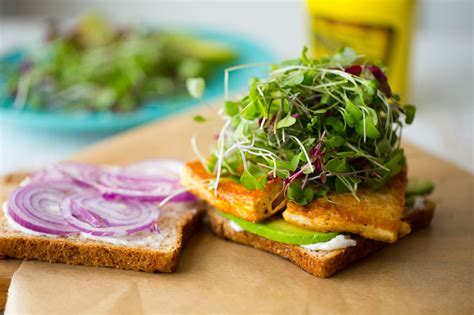 Vegan Lunch Sandwich With Sizzling Skillet Tofu Avocado And Sprouts