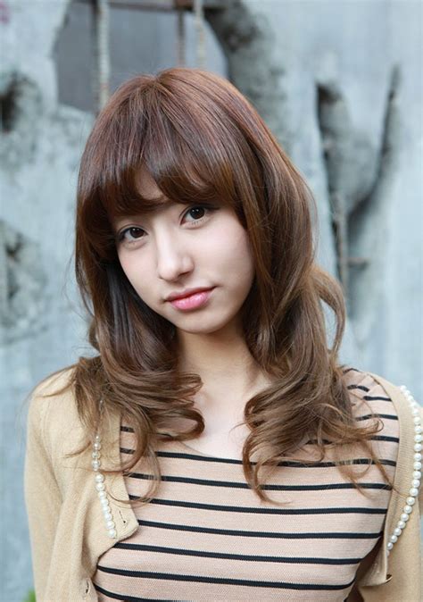 Medium hairstyles vary from geometric shapes and defined lines, and we provide hair information including face shape and hair texture to help you find the perfect. Asian Girls Shoulder Length Wavy Hairstyle with Full Bangs ...