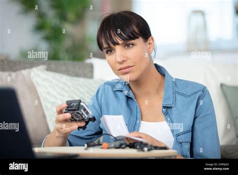 Young Woman Mounting Adventure Camera Stock Photo Alamy