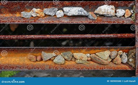 Small Stones Stuck In Rust Iron Images Suitable For The Background