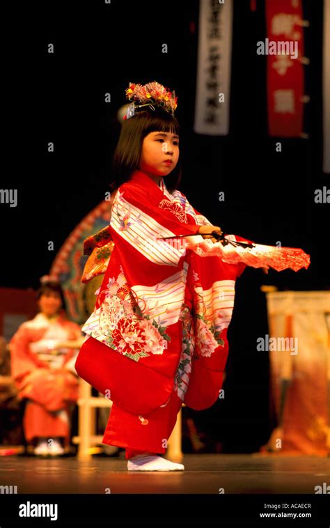 Young Japanese Girl Fan Dancer From Ikuta Shinto Shrine In Japan