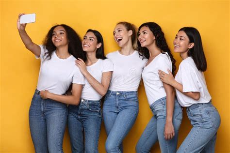 Happy Multiracial Ladies Making Selfie On Smartphone Over Yellow