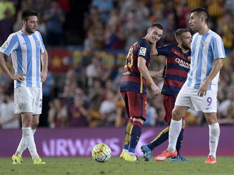 thomas vermaelen helps fc barcelona overcome stubborn malaga football