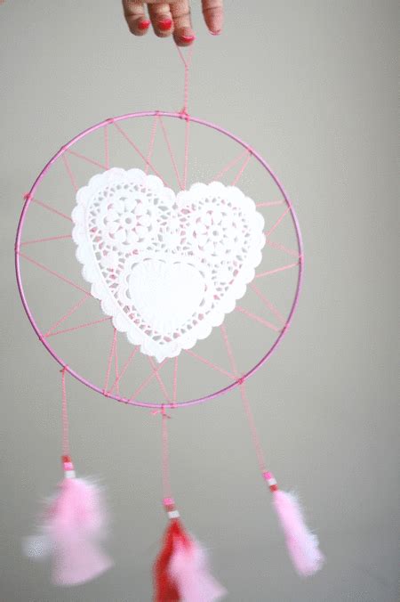 A Pink And White Heart Shaped Dream Catcher
