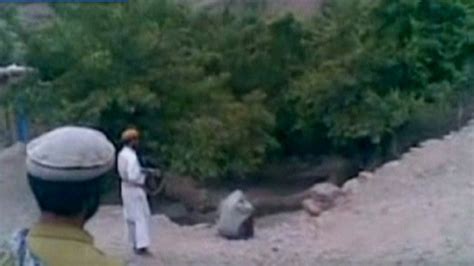 video taliban shoot woman 9 times in public execution as men cheer cnn