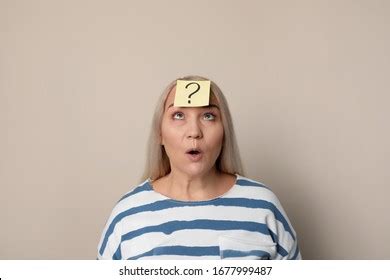 Emotional Mature Woman Question Mark On Stock Photo 1677999487