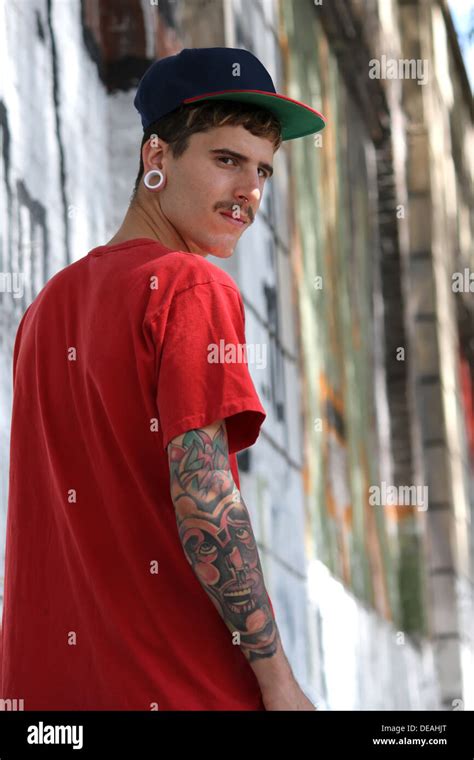 A Young Rapper Walking Down A Urban Street Stock Photo Alamy