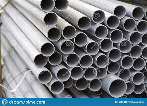 Metal Profile Pipe Of Round Section In Packs At The Warehouse Of Metal