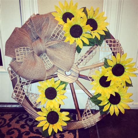 Maybe you would like to learn more about one of these? Pin by Hannah Rowlett on Feelin' crafty. | Wagon wheel decor, Farmhouse style wreath, Wagon wheel