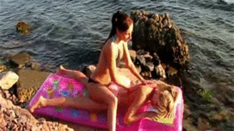 2 Girls On Beach Oiling Each Other On Mattress Inflas Balloons By Alina Friends Clips4sale