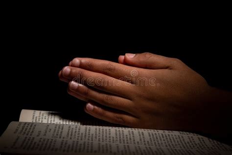 Praying Hands With Bible Background