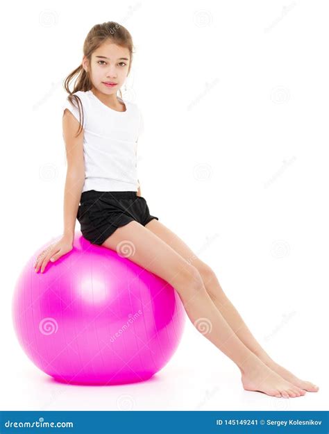 Little Girl Doing Exercises On A Big Ball For Fitness Stock Image