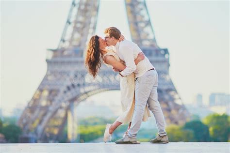 Happy Romantic Couple In Paris Near The Eiffel Tower Stock Photo