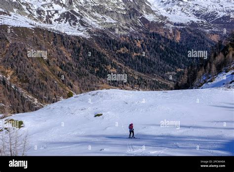 Ski Alpinist Ascending A Slope In The Swiss Alps Graubunden Stock