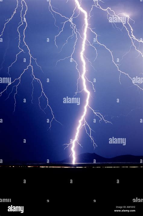 Cropped Shot Of A Huge Singular Lightning Bolt Striking Against A Dark