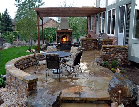 Homeadvisor.com has been visited by 100k+ users in the past month Flagstone Patio with Stone Fireplace and Outdoor Kitchen