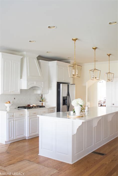 This is a big trend now and i love white kitchens but only in small quantities. Inspiring White Kitchen Remodel with Gold Accents | Maune ...