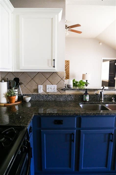 White cabinetry is a classic choice for a kitchen. Our DIY Blue & White Kitchen Cabinets - Love & Renovations