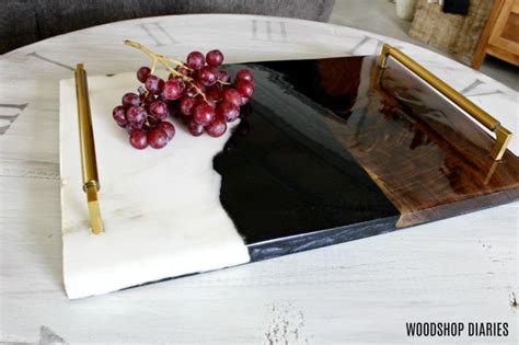 I made this tray from random scrap piece of walnut, a piece of marble, and filled in the middle with resin. Wood + Marble + Resin DIY Serving Tray--{A Unique Tutorial}