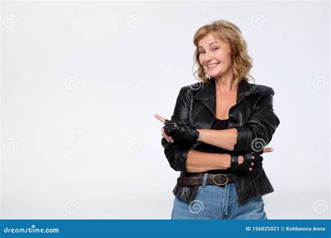 Mmature Woman In Leather Jacket Pointing At Copy Space Stock Image Image Of Amazement Finger