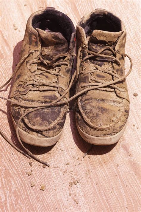 Dirty Shoes With Dried Mud On The Floor Stock Image Image Of White
