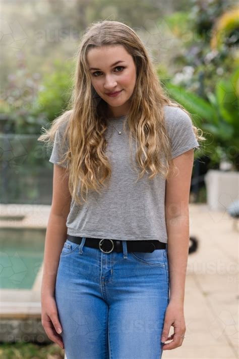 Image Of Simple Portrait Of Pretty Teen In Jeans And Tee Shirt