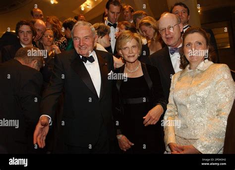 David Rockefeller extends his hand as multiple generations of the