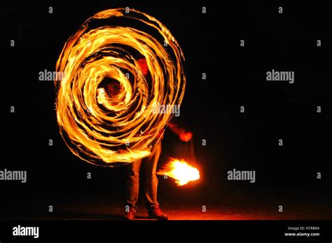 Spinning Fire Poi Stock Photo Alamy