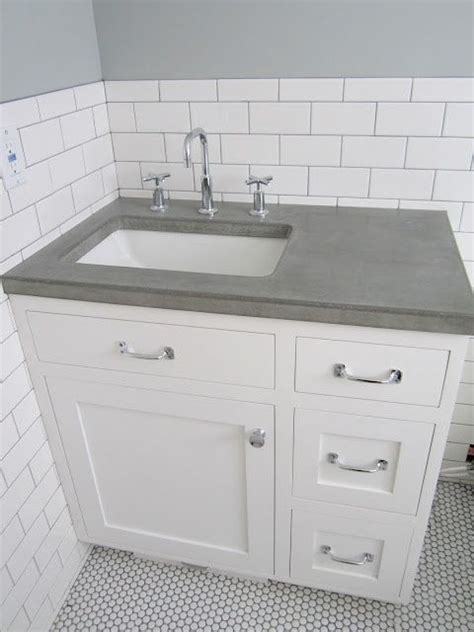 If that is the look you. White subway tile wall + concrete counters + white penny ...