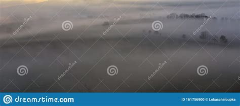 Aerial View To Autumn Misty Fog Landscape With Trees In Sunrise Czech