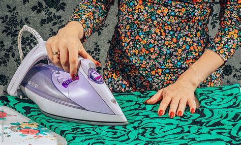 Pressing Garment While Ironing By Stocksy Contributor Audshule