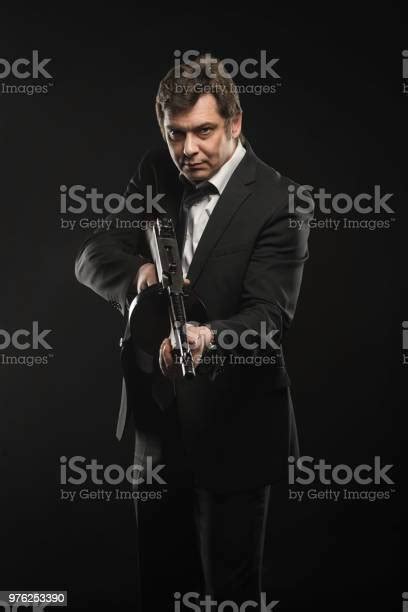 Handsome Middle Aged Man Gangster With Thompson Machine Gun Stock Photo