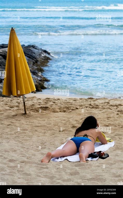 Rear View Of A Woman Lying On The Beach Waikiki Beach Honolulu Oahu