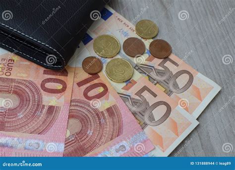 Black Wallet With Euro Currency Banknotes And Coins Stock Photo Image
