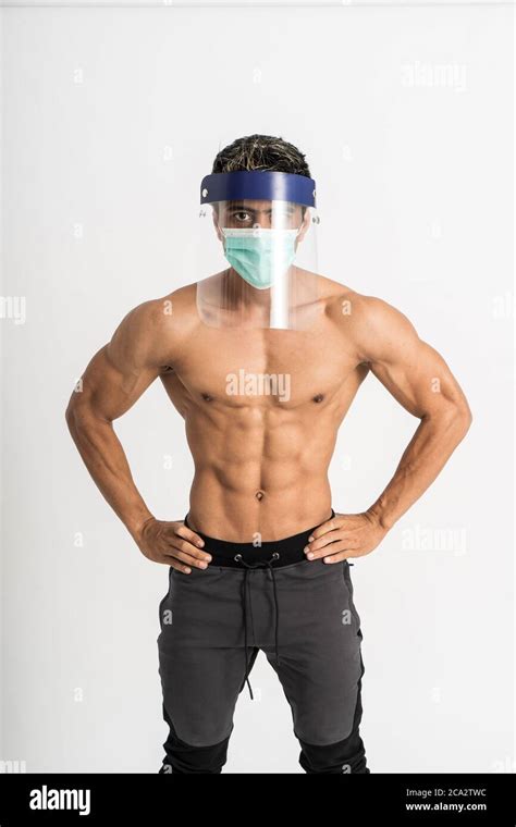 Asian Man Show Muscular Bodies Wearing A Mask And Face Shield With Two