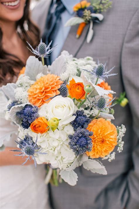 Vibrant floral centerpieces at indian wedding. Orange Wedding Flowers | Wedding Ideas by Colour | CHWV