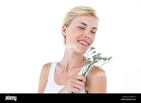 Gorgeous Blonde Woman Smelling Flowers Stock Photo Alamy