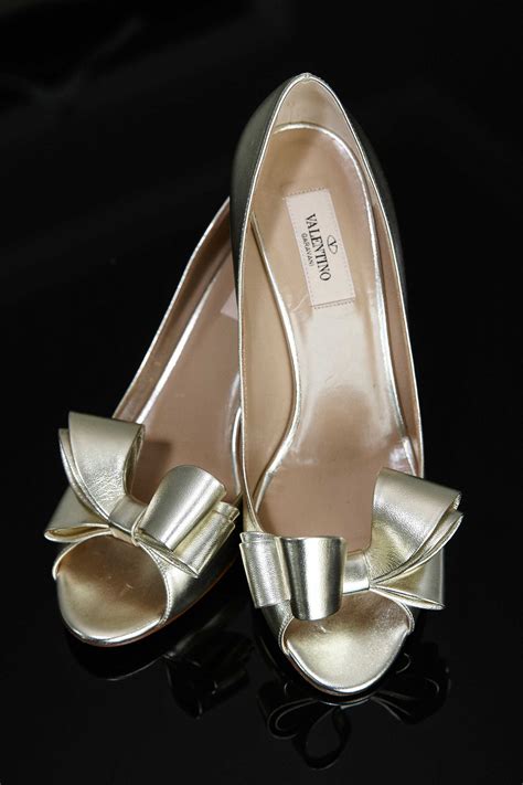 gold peep toe pumps with bows